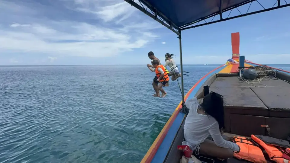 A splash into the sea from the boat!