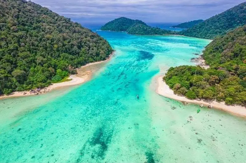 Sandy coastline and turquoise water at the Surin Islands