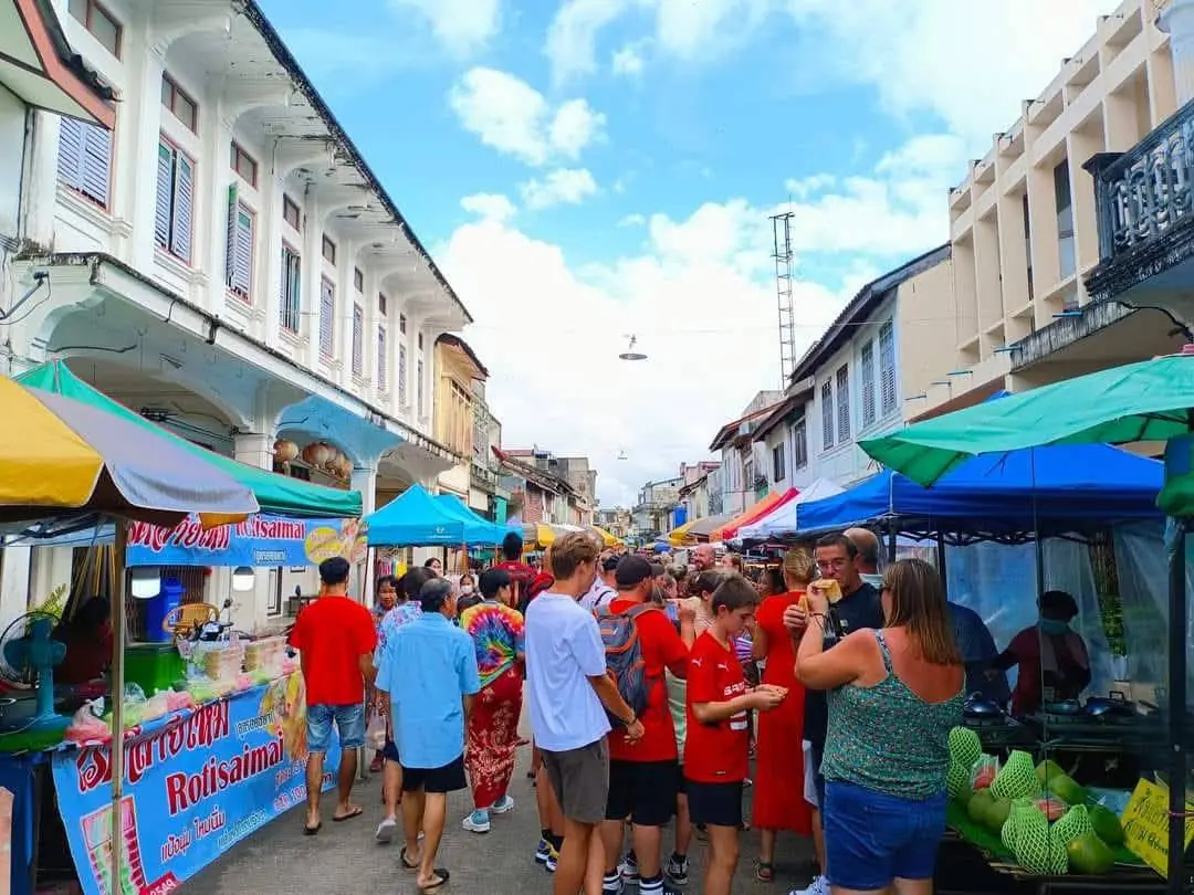 Visitors browsing the Takua Pa Sunday market