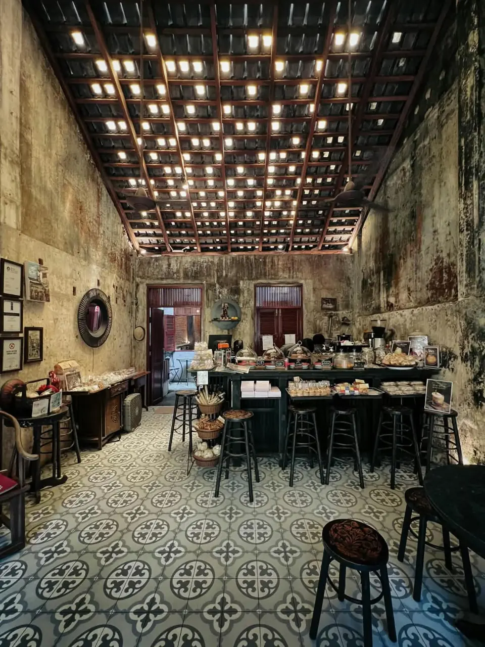 Historic interior decorated with hanging lights in Takua Pa
