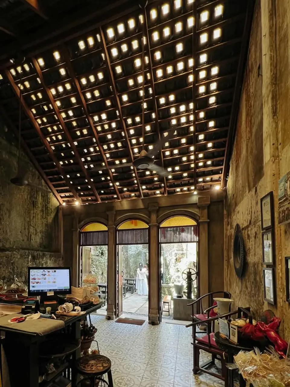 Historic interior decorated with hanging lights in Takua Pa